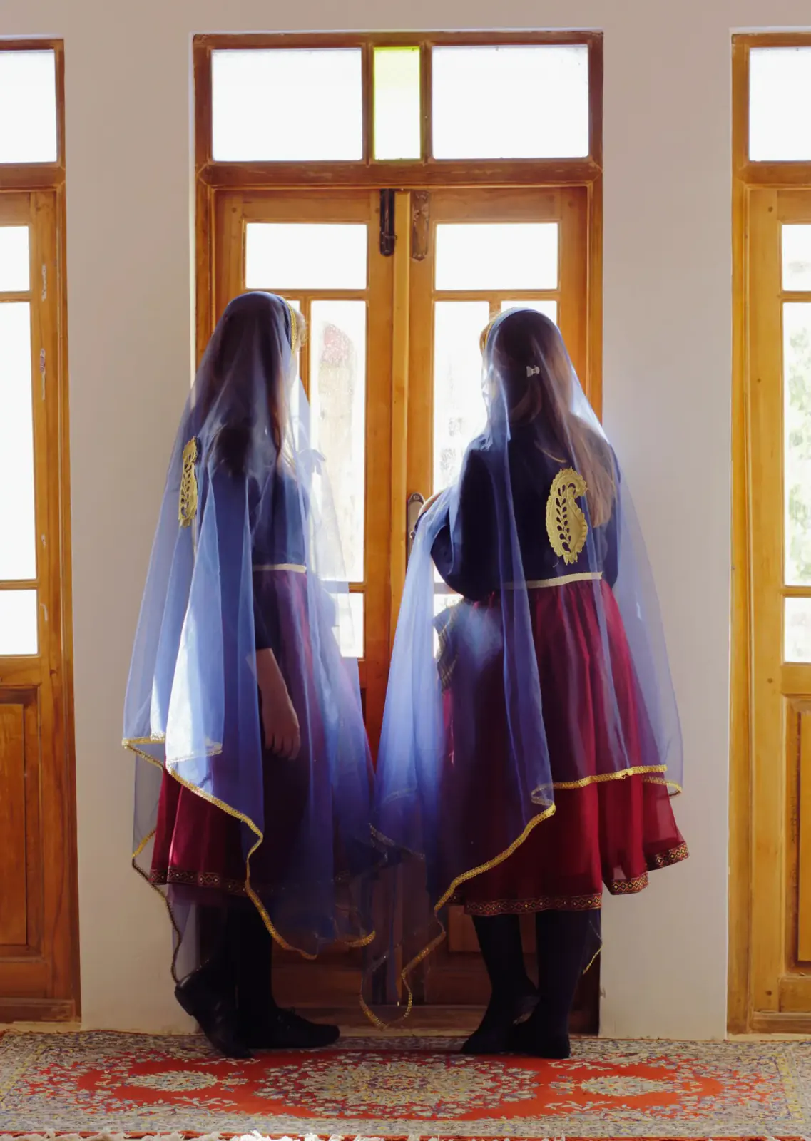 Two dancers performing indoors