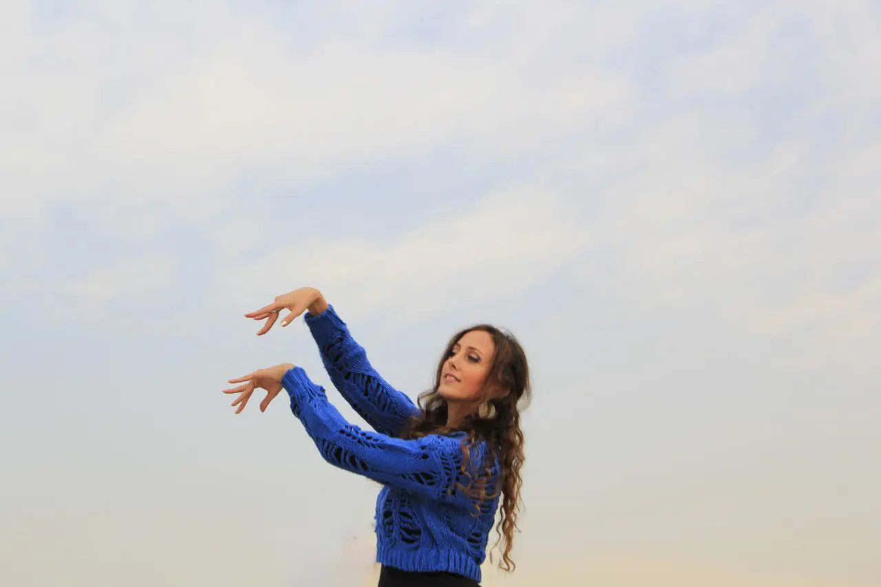 Banafsheh Amiri performing a movement study on a Tehran rooftop