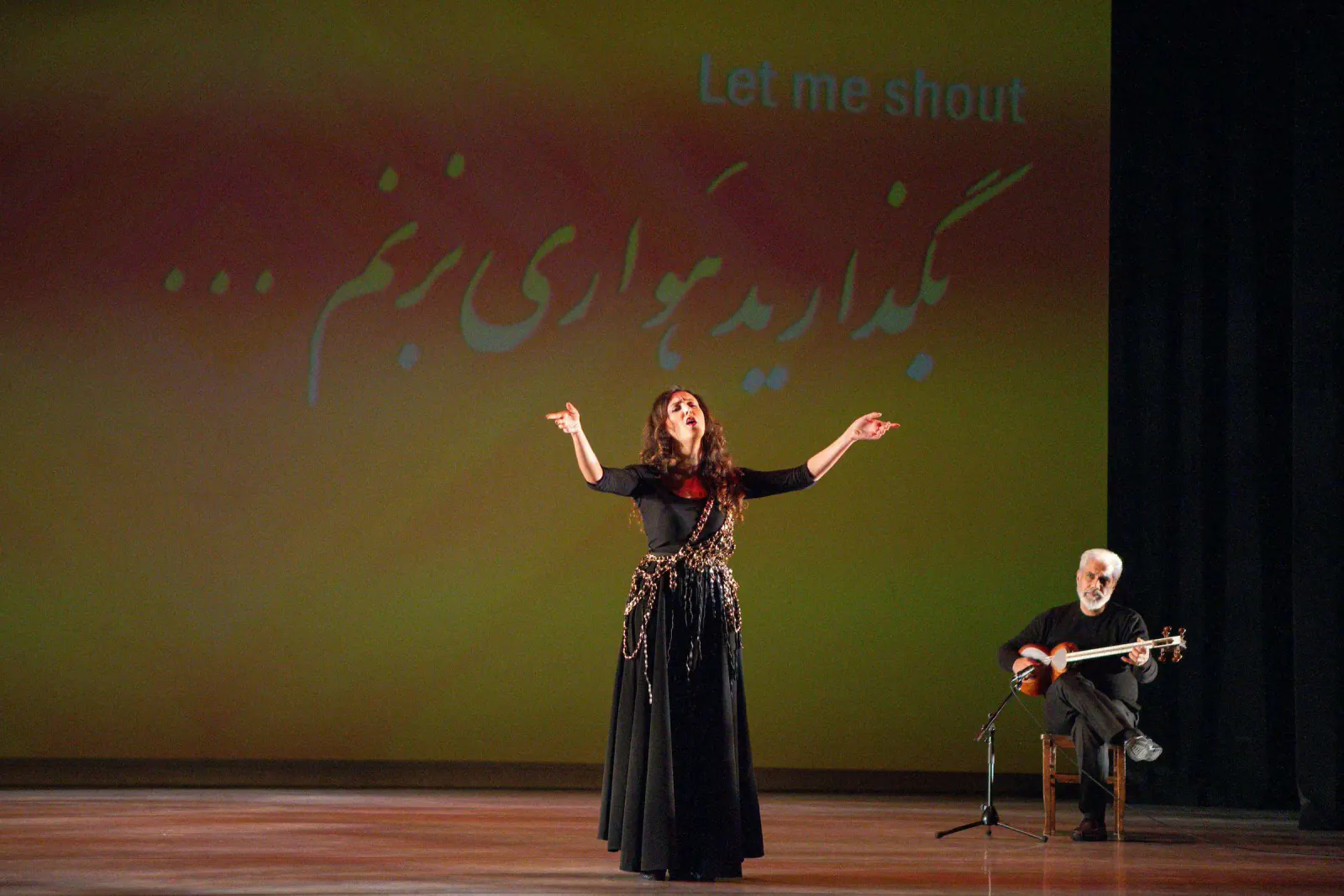 Faryad combining live performance, music, and projected words