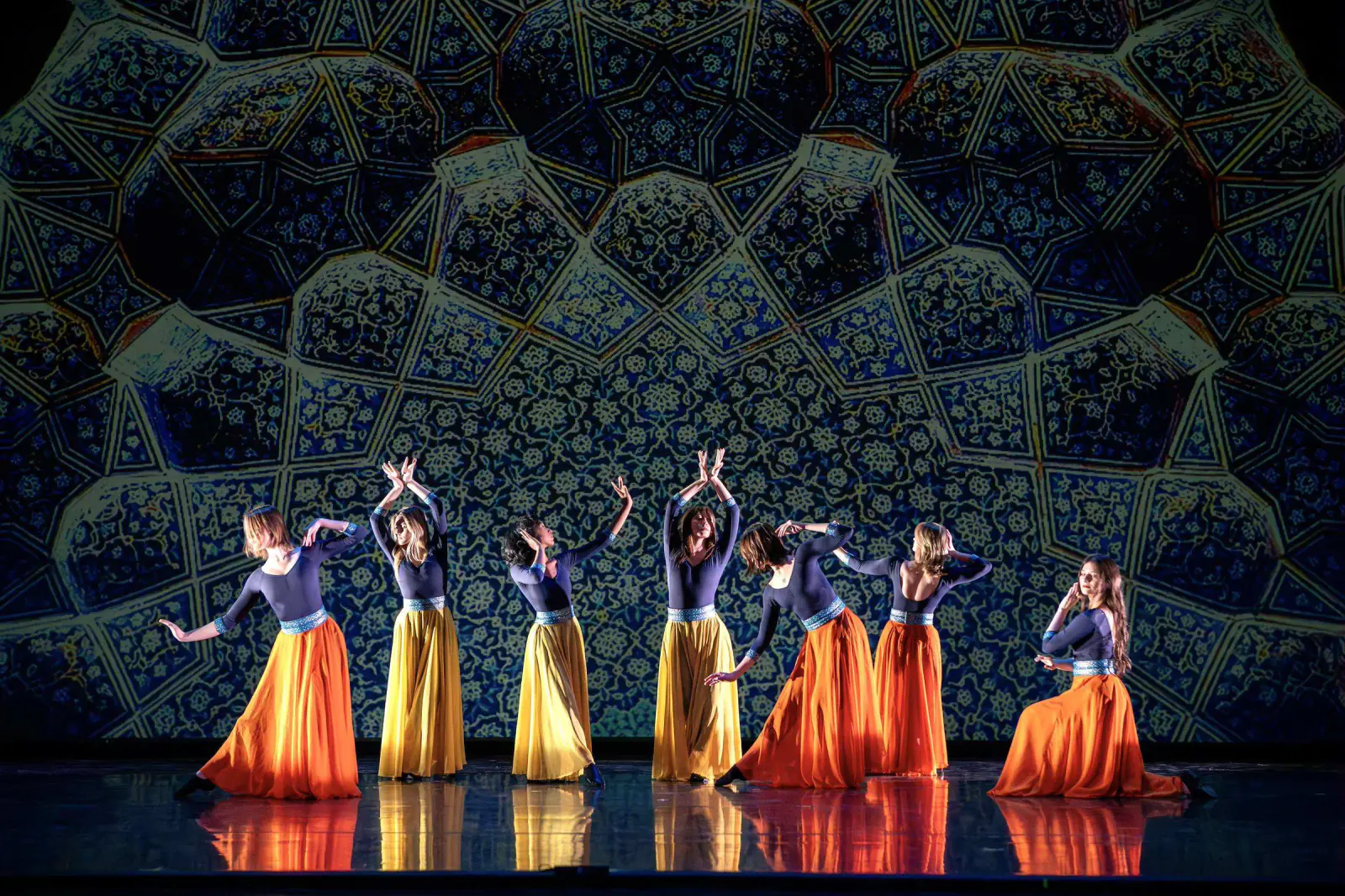 The Khazan ensemble performing beneath projected Iranian architectural imagery